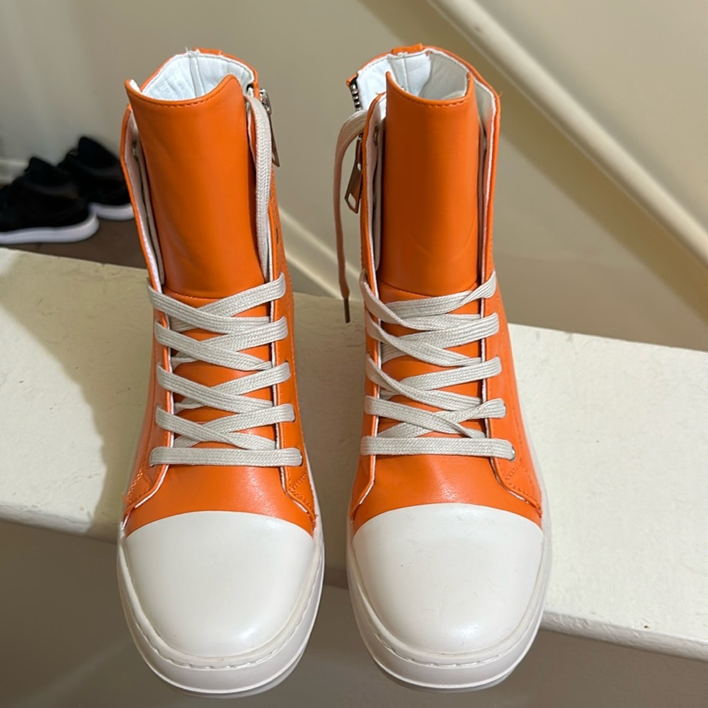 Orange and cream dressy like sneakers. Women’s size 8.